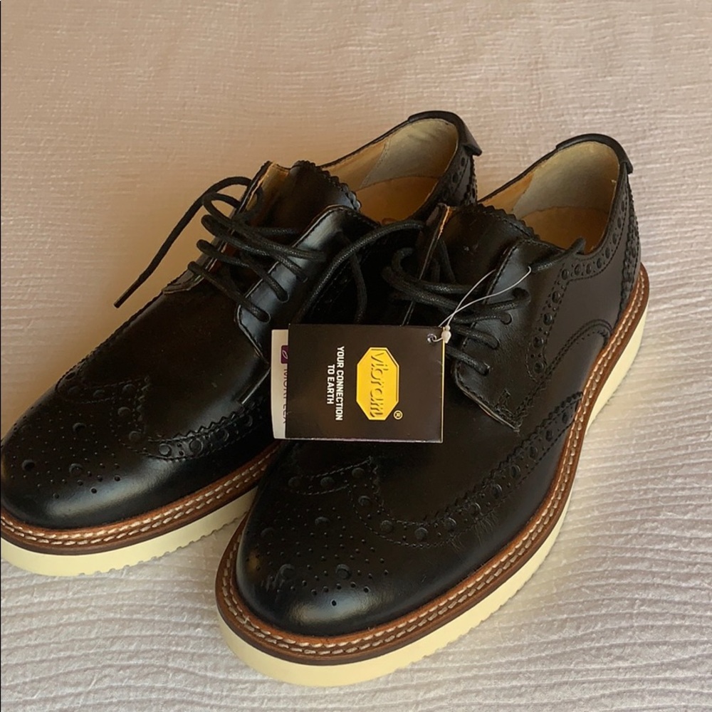 Black leather wing tip shoes. High quality!! New